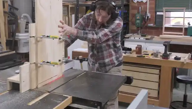 Is it necessary to utilize a push stick when making a 22.5-degree angle cut on a table saw
